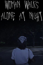 WOMAN WALKS ALONE AT NIGHT